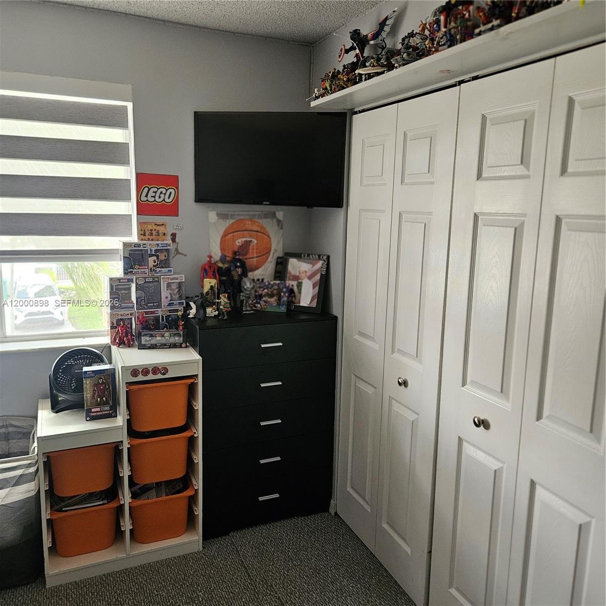 7378 Southwest 162nd Place Miami, FL 33193 - Photo 19 of 37 a room with storage and utility