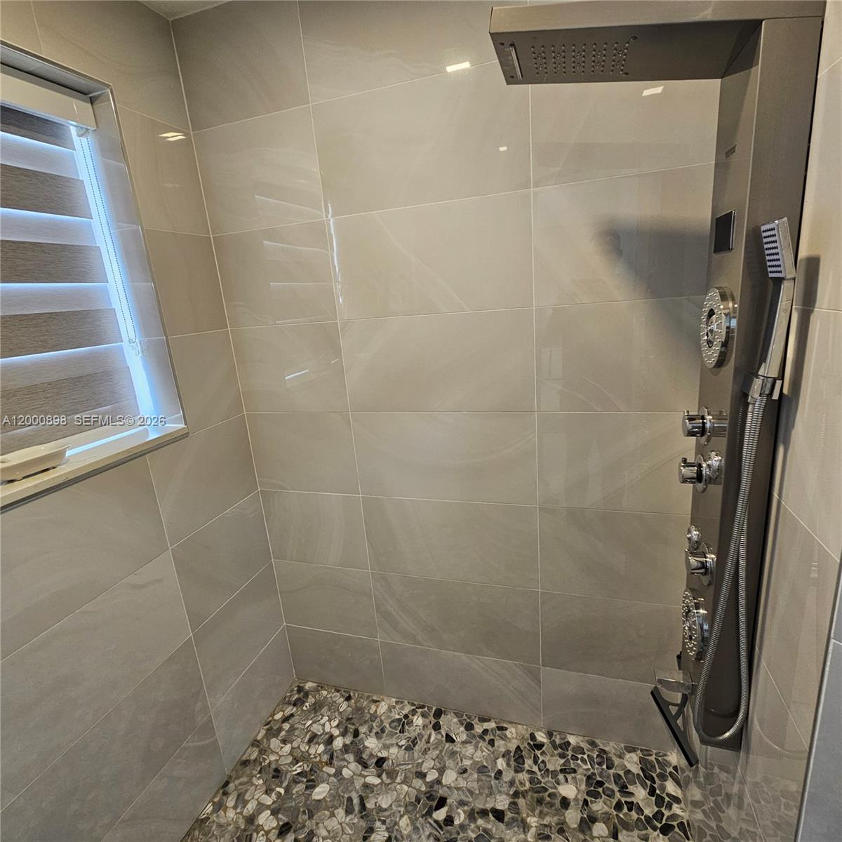 7378 Southwest 162nd Place Miami, FL 33193 - Photo 31 of 37 a bathroom with a shower