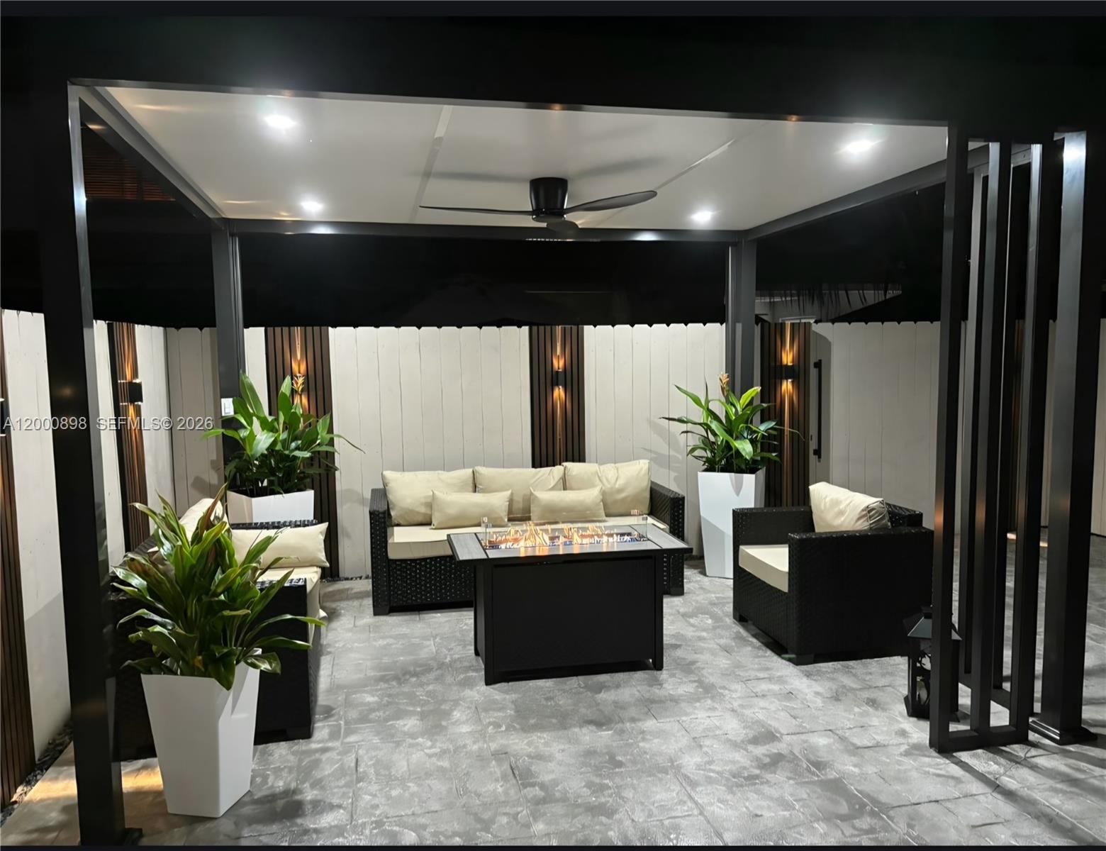 7378 Southwest 162nd Place Miami, FL 33193 - Photo 36 of 37 a living room with furniture and a potted plant