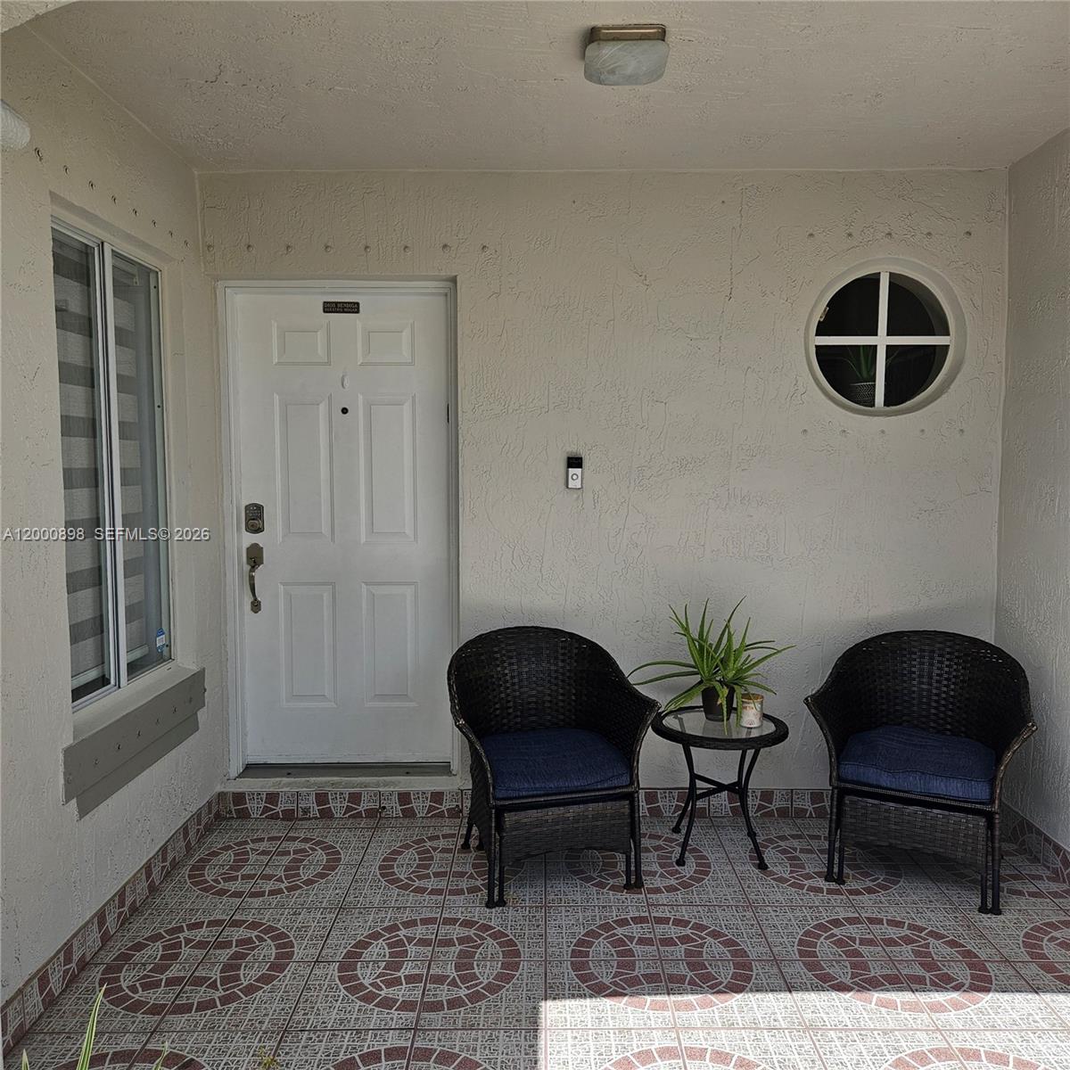 7378 Southwest 162nd Place Miami, FL 33193 - Photo 5 of 37 a living room with furniture and a rug