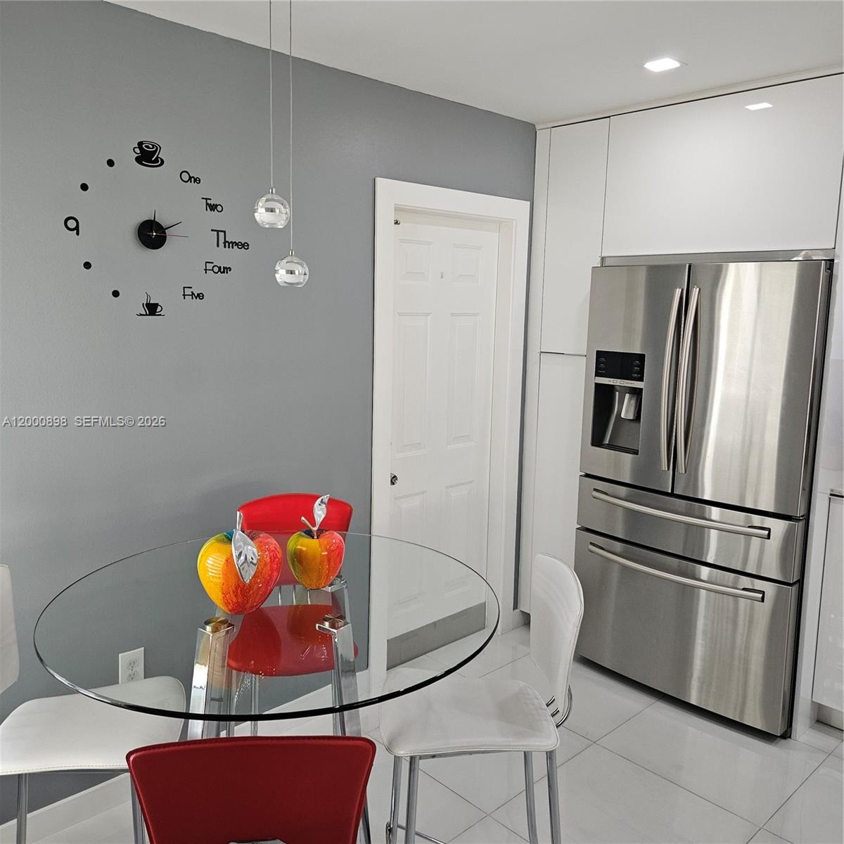 7378 Southwest 162nd Place Miami, FL 33193 - Photo 8 of 37 a kitchen with stainless steel appliances granite countertop a refrigerator sink and stove