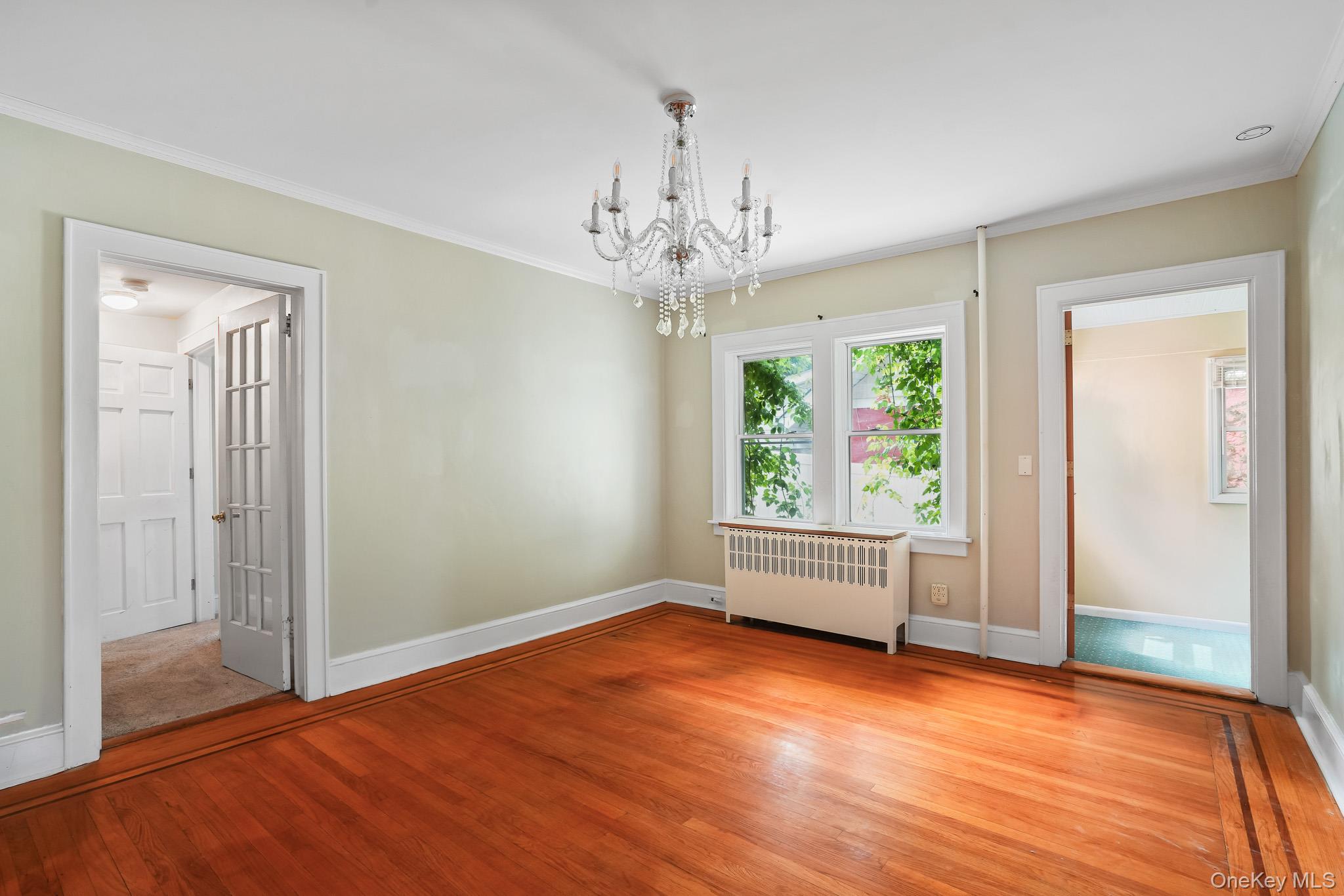 211 Pomeroy Street Peekskill, NY 10566 - Photo 12 of 50 Original inlaid hardwood floors and chandelier