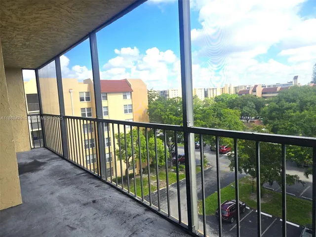 a view of a swimming pool with a lounge chair