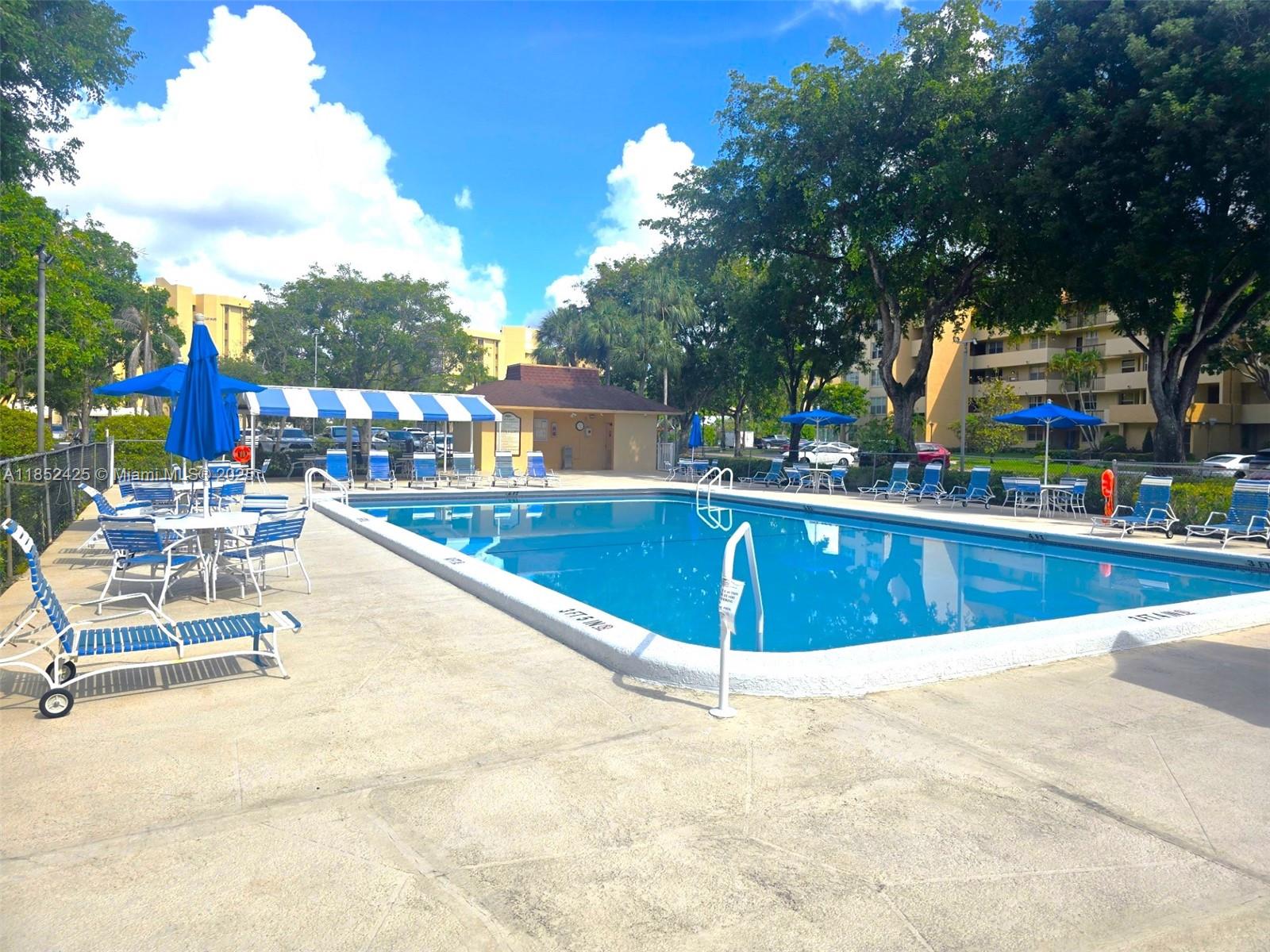 3821 Environ Boulevard, Unit 610 Lauderhill, FL 33319 - Photo 14 of 19 a view of a swimming pool with a lounge chair
