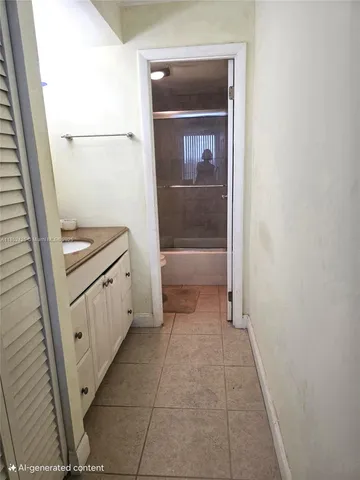 a bathroom with a sink a toilet and a shower