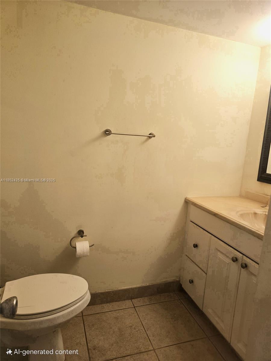 3821 Environ Boulevard, Unit 610 Lauderhill, FL 33319 - Photo 10 of 19 a bathroom with a toilet and a sink