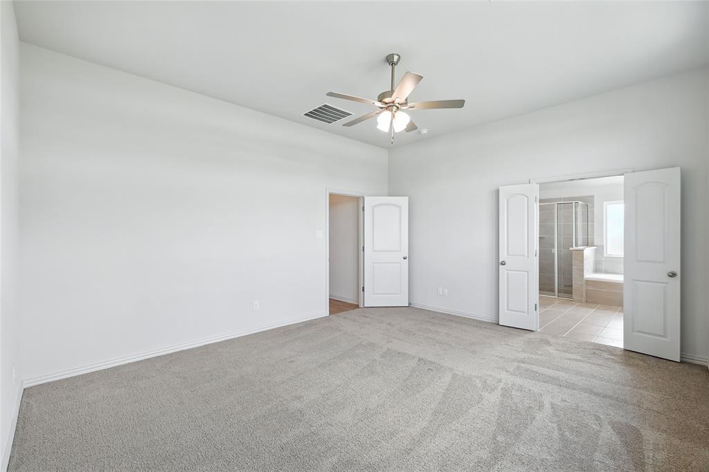 3704 Pitchfork Terrace Anna, TX 75409 - Photo 16 of 31 an empty room with a bathroom and a fan