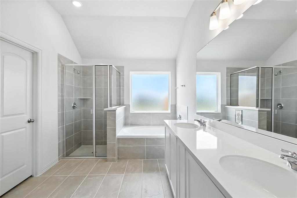 3704 Pitchfork Terrace Anna, TX 75409 - Photo 18 of 31 a bathroom with a tub sink and mirror
