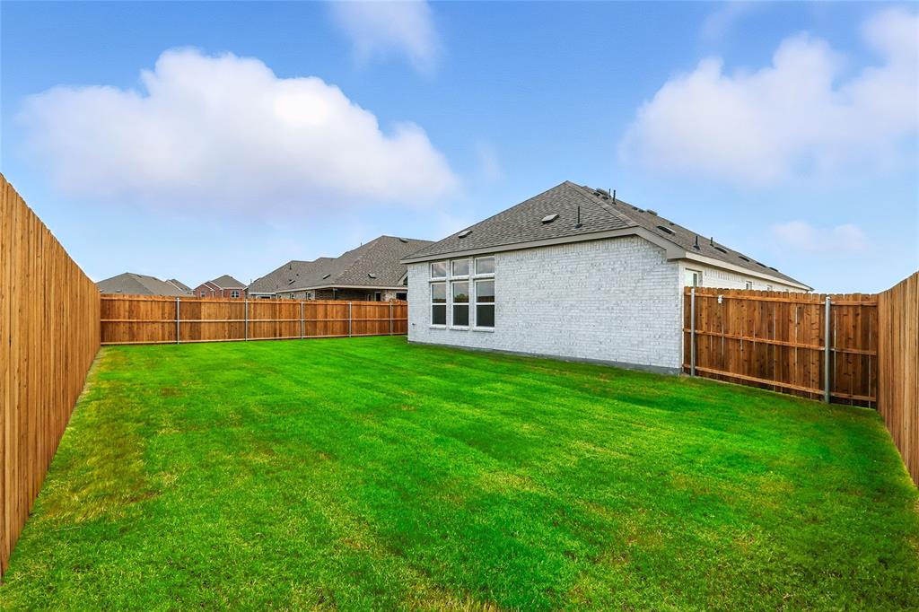 3704 Pitchfork Terrace Anna, TX 75409 - Photo 26 of 31 a view of a house with backyard and garden