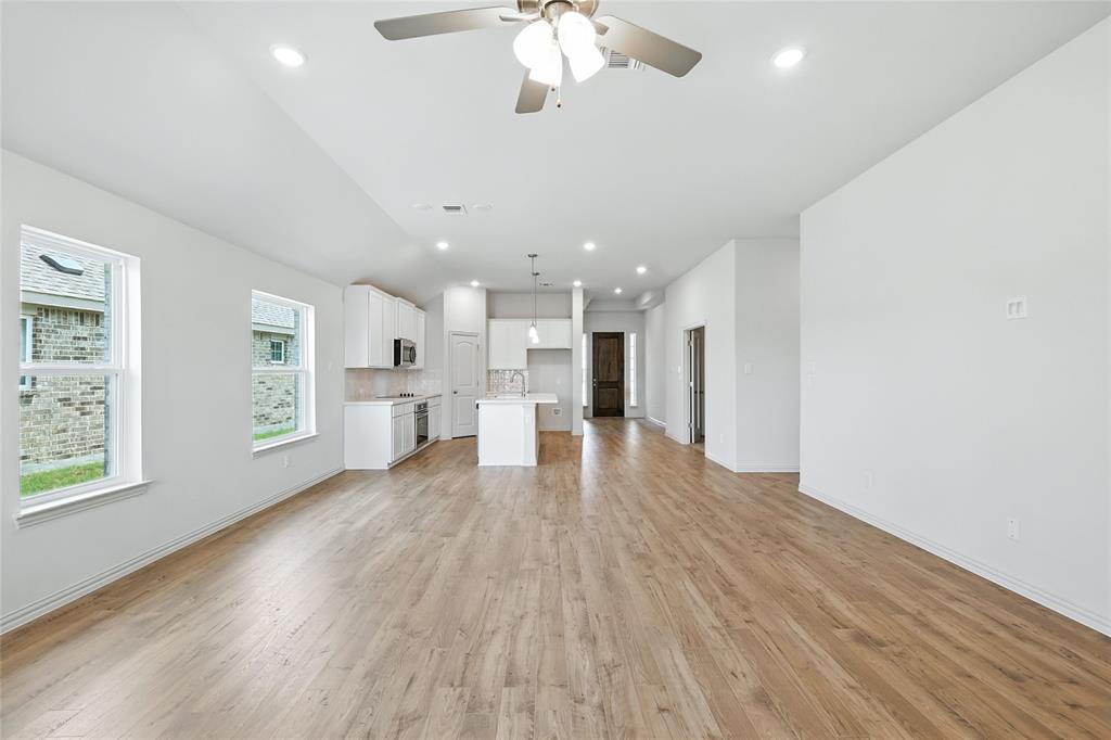 3704 Pitchfork Terrace Anna, TX 75409 - Photo 10 of 31 a view of kitchen with cabinets and wooden floor