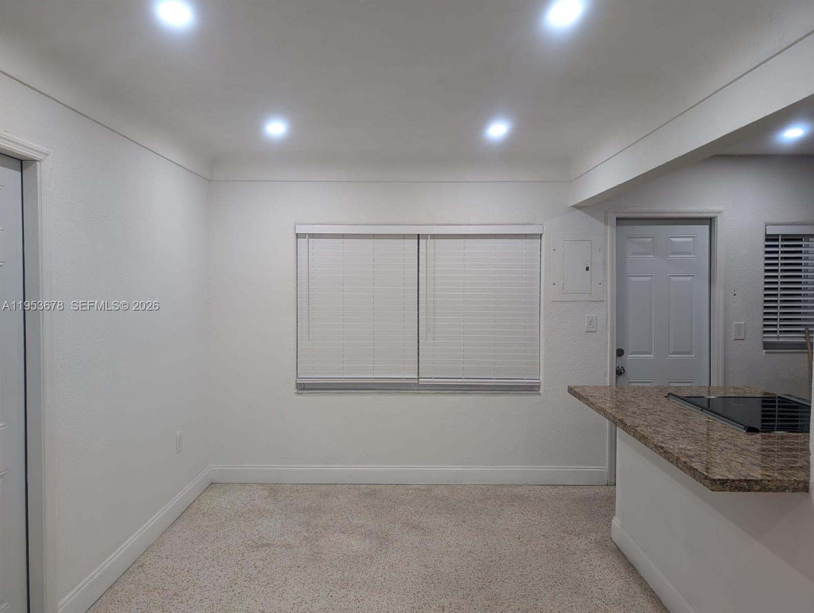 2355 Northwest 9th Street Miami, FL 33125 - Photo 4 of 16 a bathroom with a granite countertop sink mirror and vanity