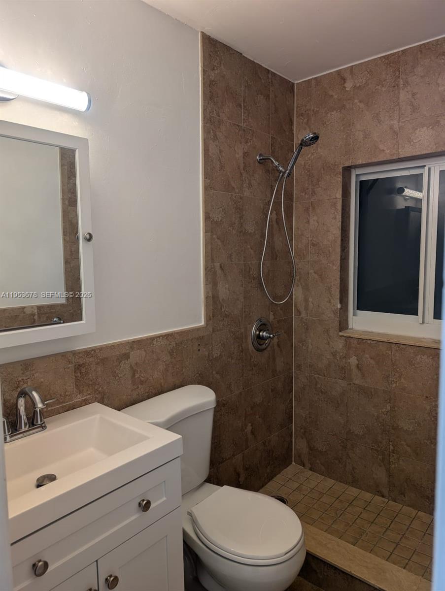2355 Northwest 9th Street Miami, FL 33125 - Photo 9 of 16 a bathroom with a sink a toilet and shower