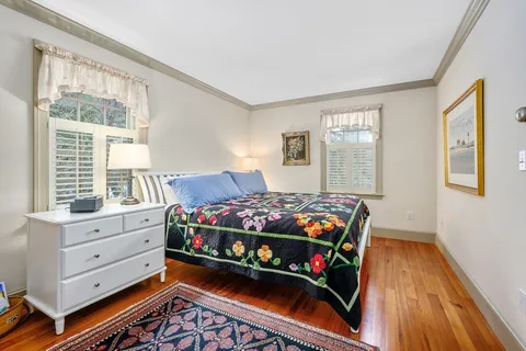 a bed room with a bed and a window