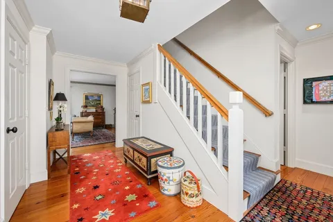 a living room with furniture and a rug