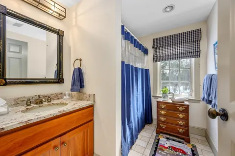 a view of bathroom with dual sinks