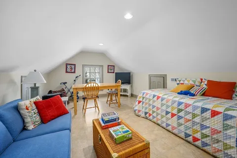 a bedroom with furniture and a couch
