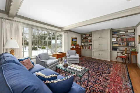 a living room with furniture and a rug