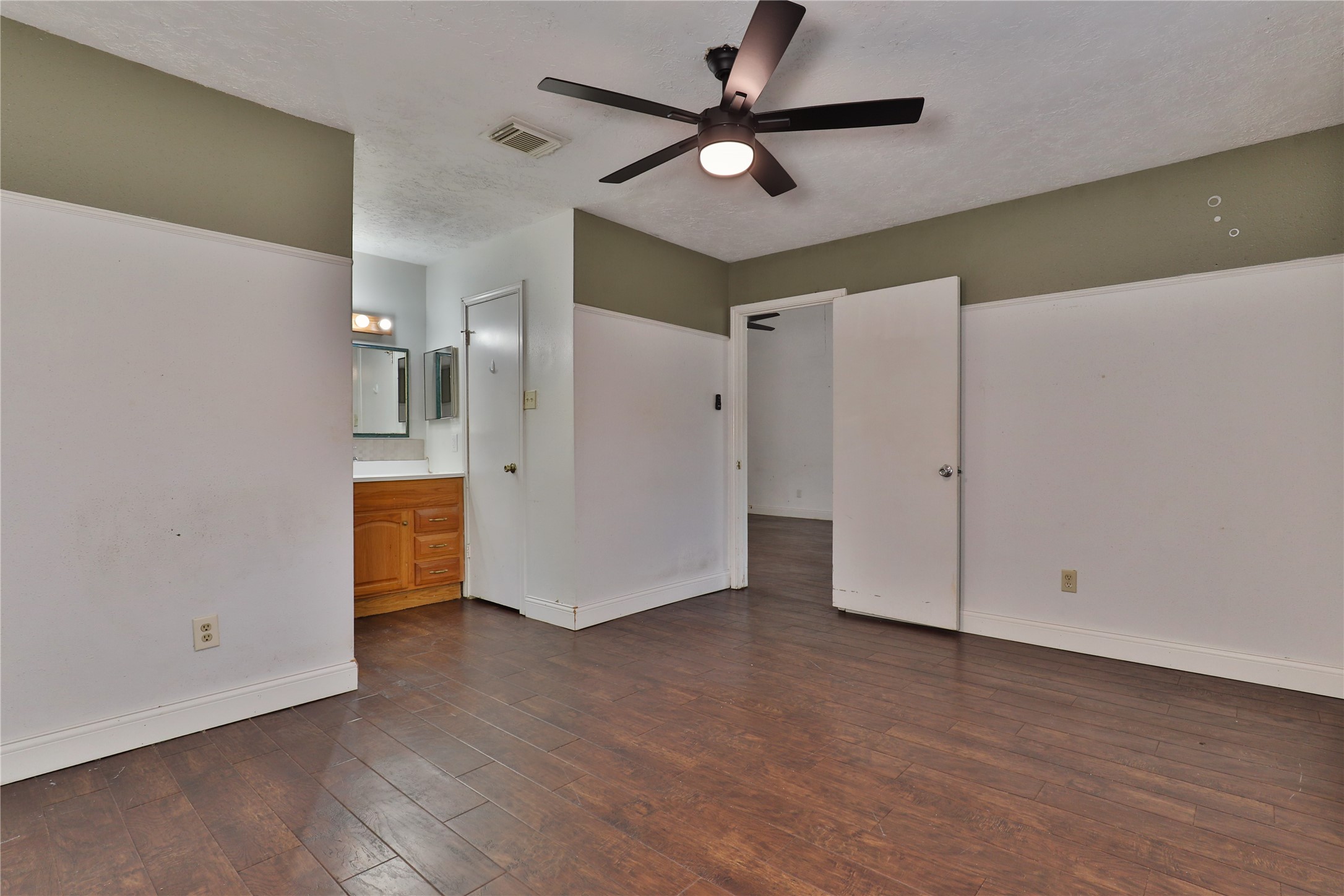 3 Ranch House Loop Angleton, TX 77515 - Photo 14 of 25 a view of an empty room with a fan