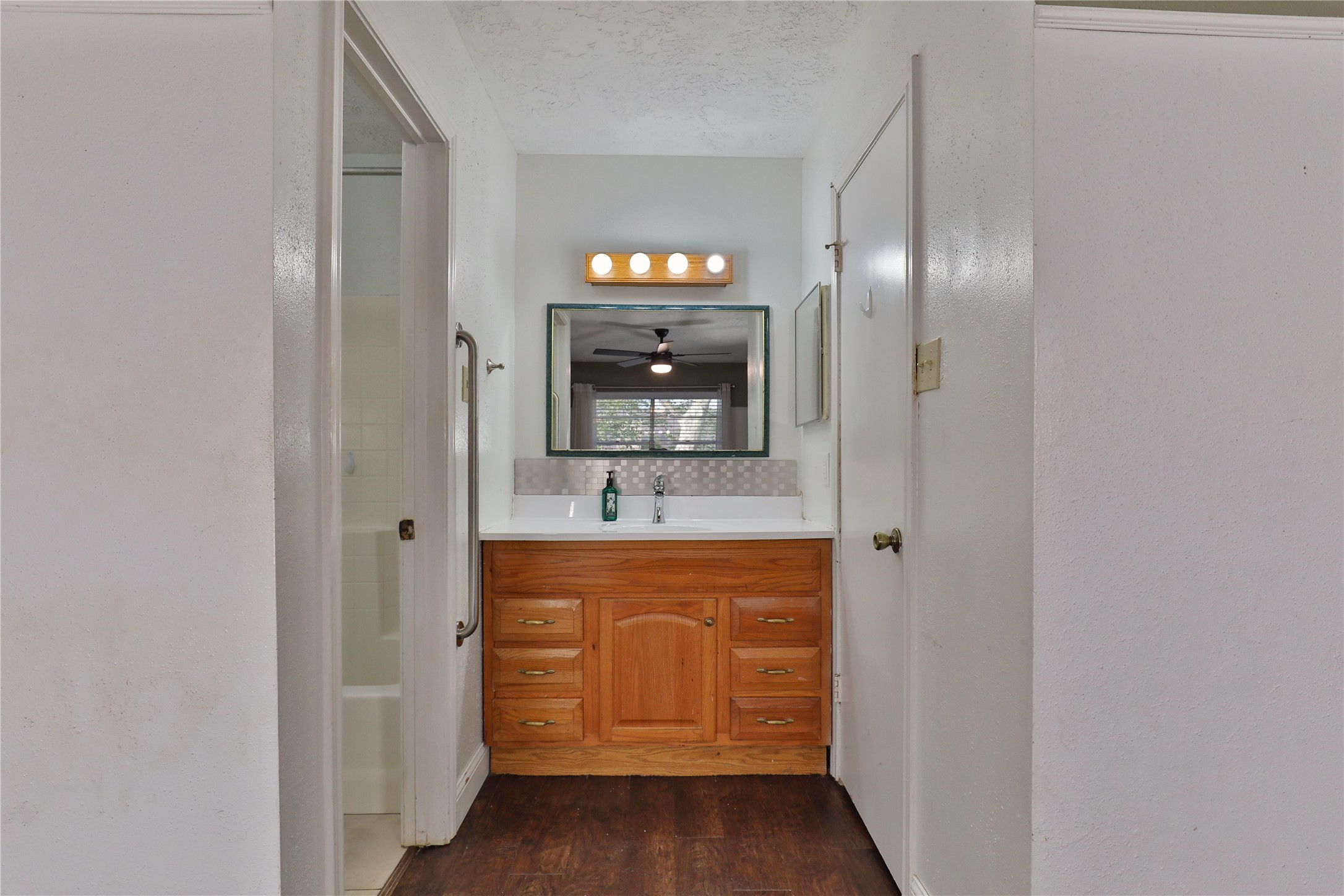 3 Ranch House Loop Angleton, TX 77515 - Photo 15 of 25 a bathroom with a sink and a mirror