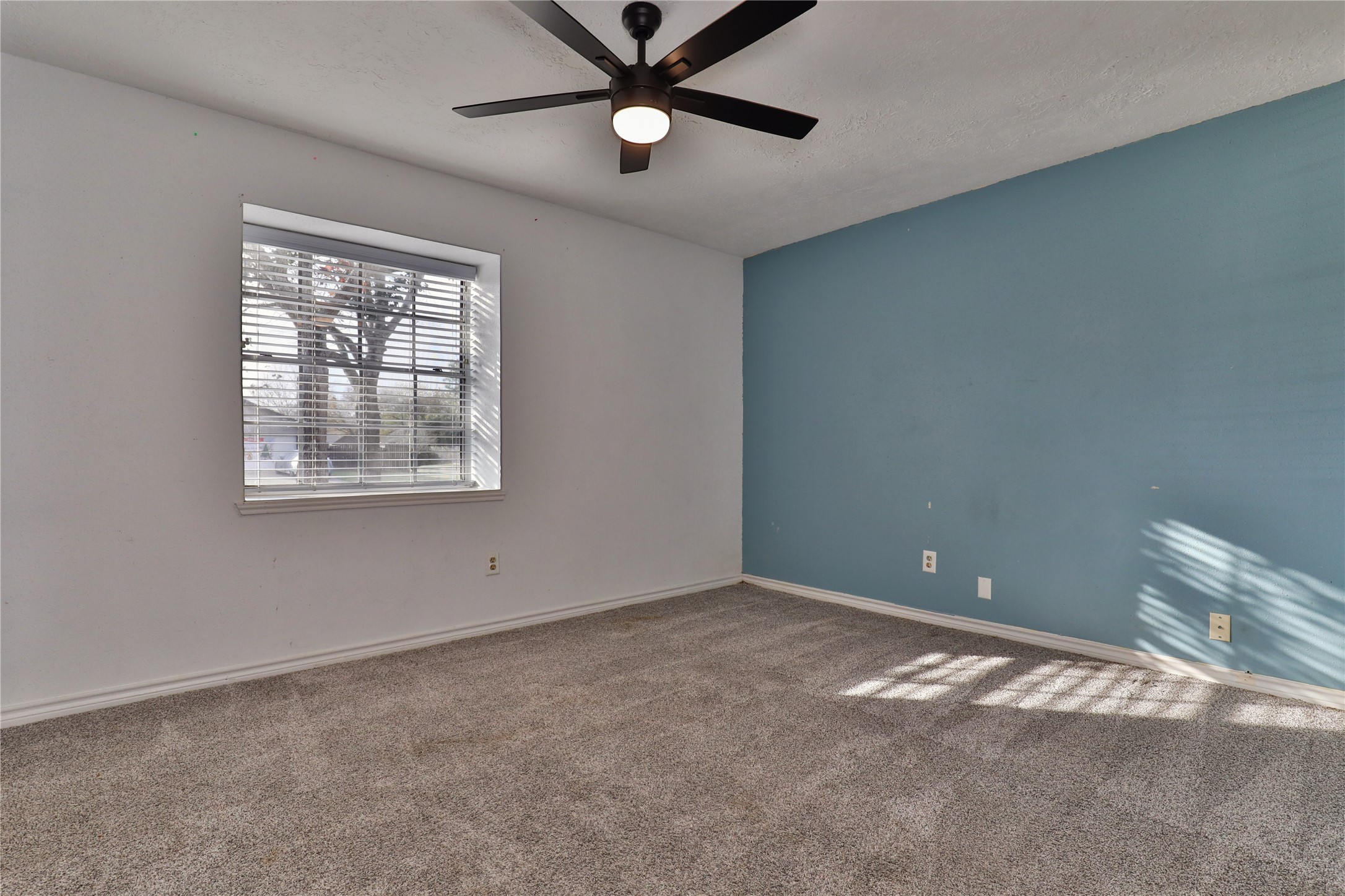 3 Ranch House Loop Angleton, TX 77515 - Photo 19 of 25 a view of an empty room with a window