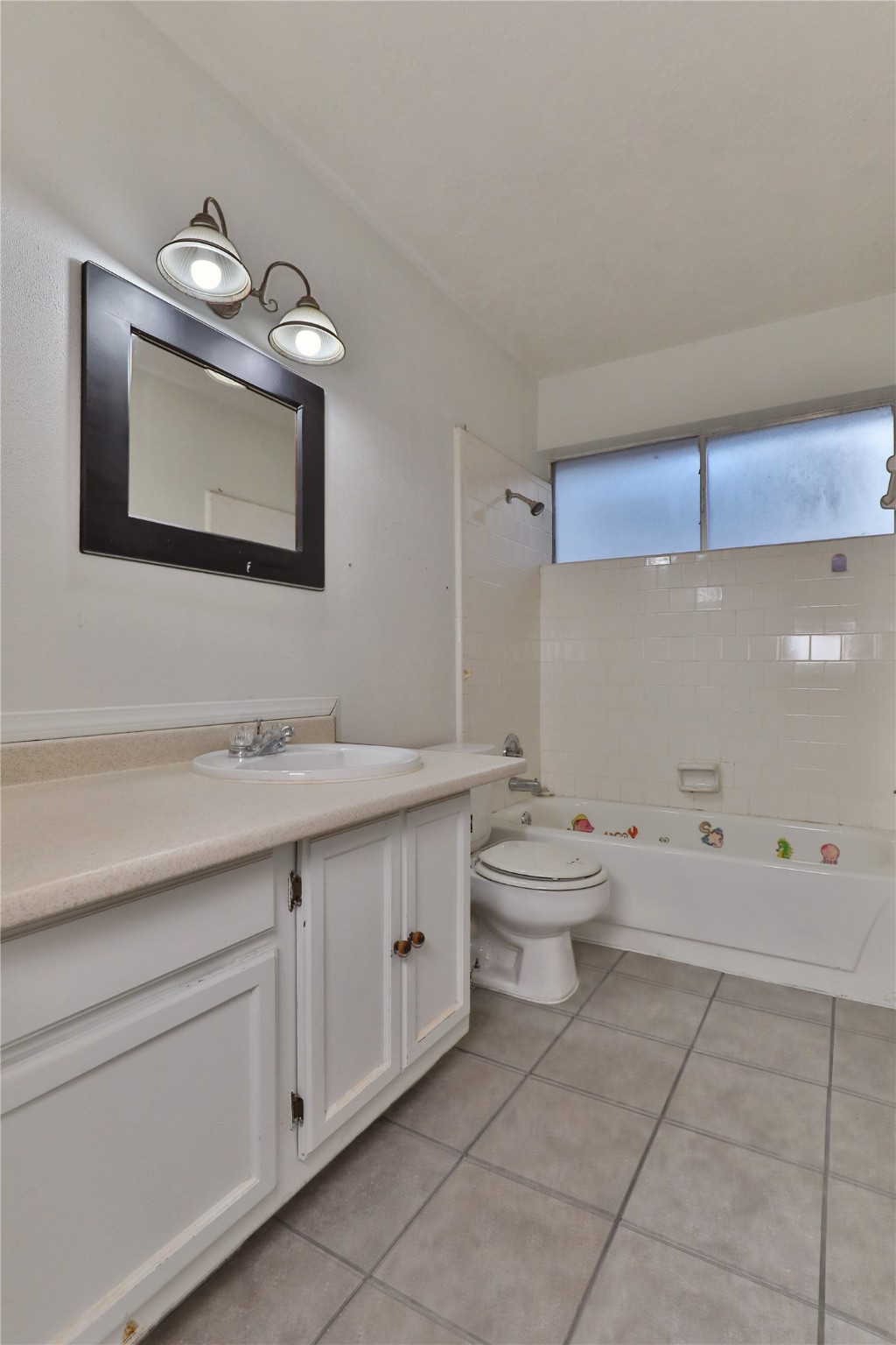 3 Ranch House Loop Angleton, TX 77515 - Photo 21 of 25 a bathroom with a toilet sink and mirror