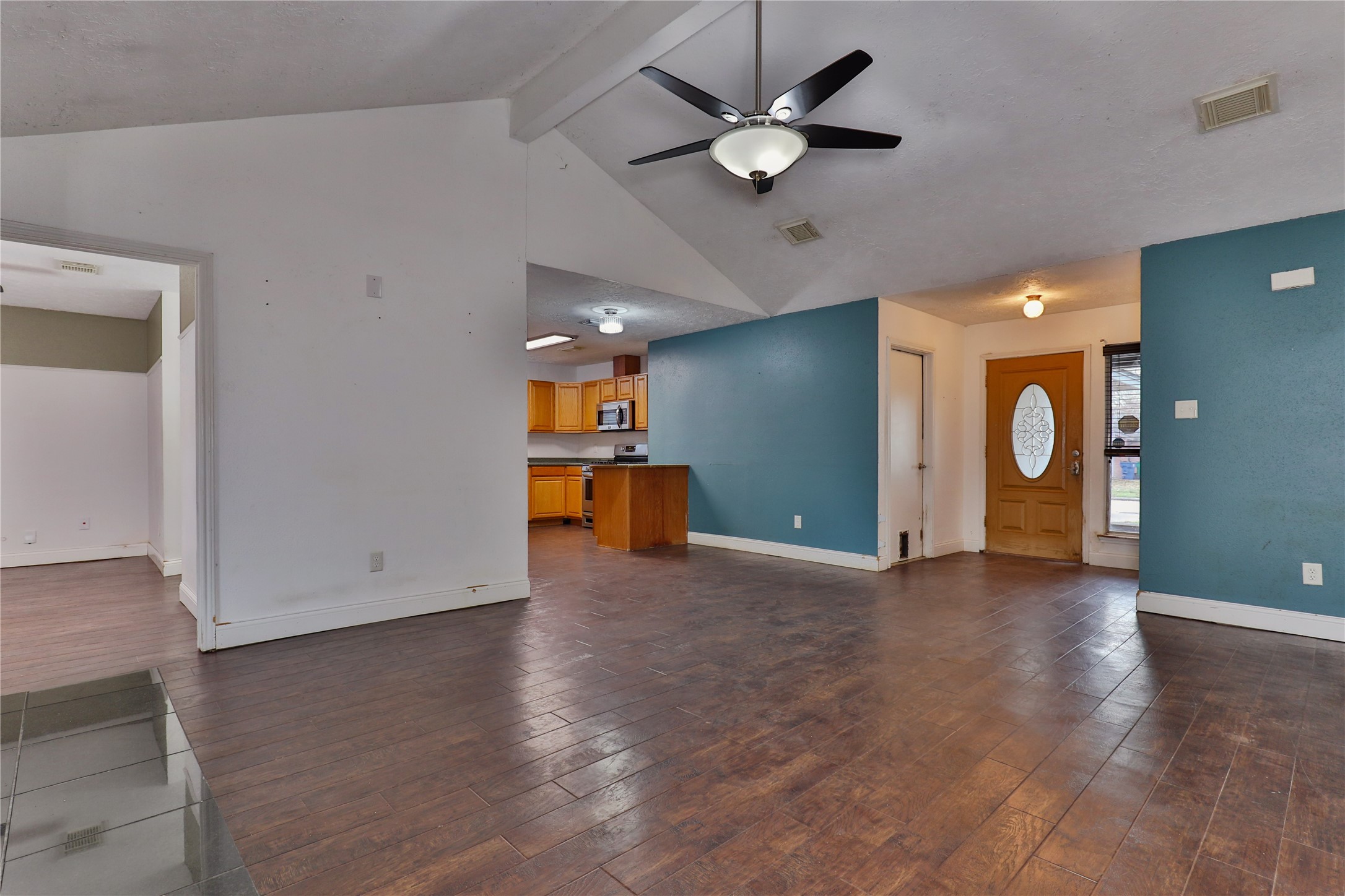 3 Ranch House Loop Angleton, TX 77515 - Photo 6 of 25 an empty room with projector and a ceiling fan