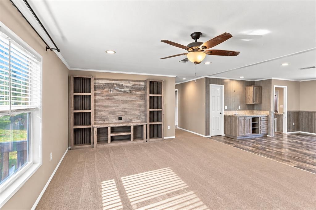 5519 Upper Denton Road Weatherford, TX 76085 - Photo 11 of 40 Built-in entertainment center, recessed lighting, ceiling fan, wood-finish flooring, and built-in wet bar with countertop