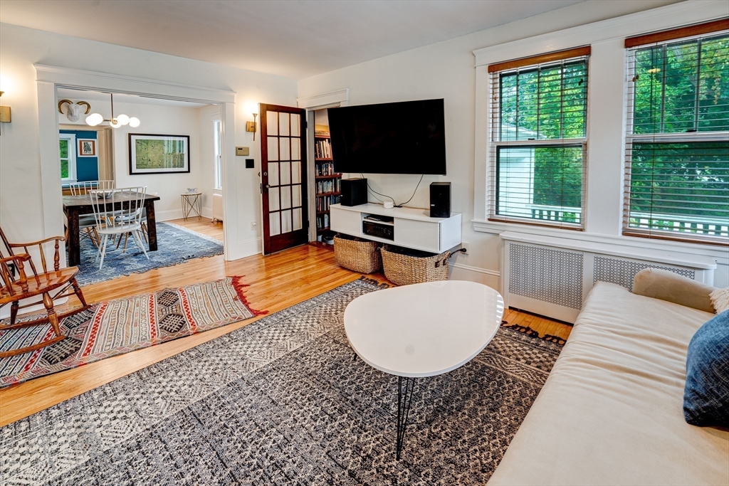 90 Main Street Acton, MA 01720 - Photo 13 of 38 a living room with furniture and a flat screen tv