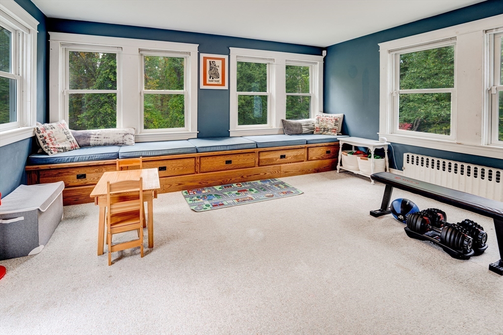 90 Main Street Acton, MA 01720 - Photo 15 of 38 a room with furniture and a large window