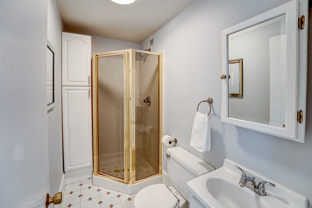 90 Main Street Acton, MA 01720 - Photo 17 of 38 a bathroom with a sink toilet and shower