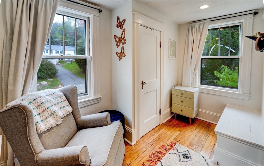 90 Main Street Acton, MA 01720 - Photo 22 of 38 a bedroom with furniture and a window