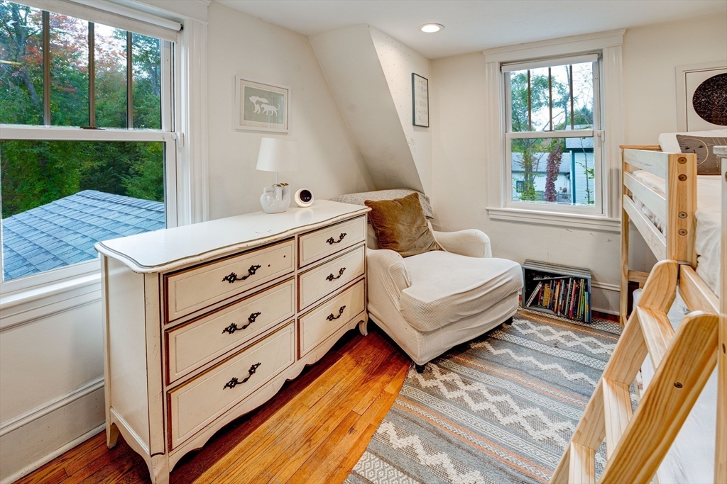 90 Main Street Acton, MA 01720 - Photo 24 of 38 a living room with furniture and a floor to ceiling window