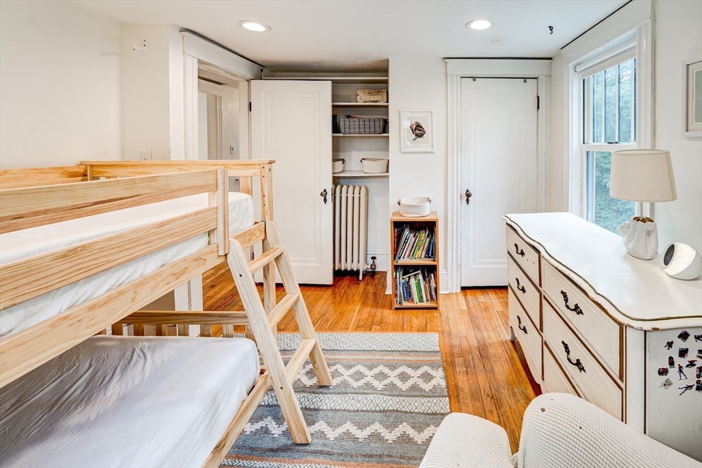 90 Main Street Acton, MA 01720 - Photo 26 of 38 a living room with furniture and a table