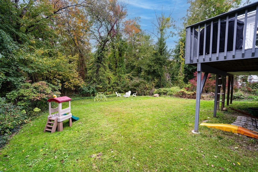 90 Main Street Acton, MA 01720 - Photo 30 of 38 a backyard of a house with table and chairs