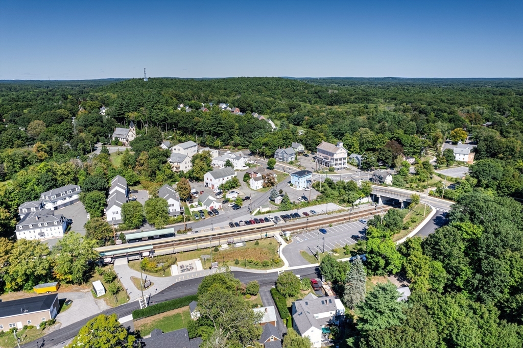 90 Main Street Acton, MA 01720 - Photo 34 of 38 an aerial view of residential houses with outdoor space and trees