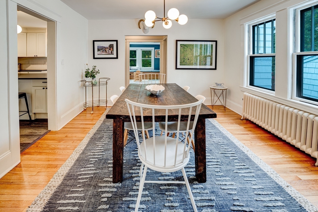 90 Main Street Acton, MA 01720 - Photo 9 of 38 a dining room with wooden floor and a rug