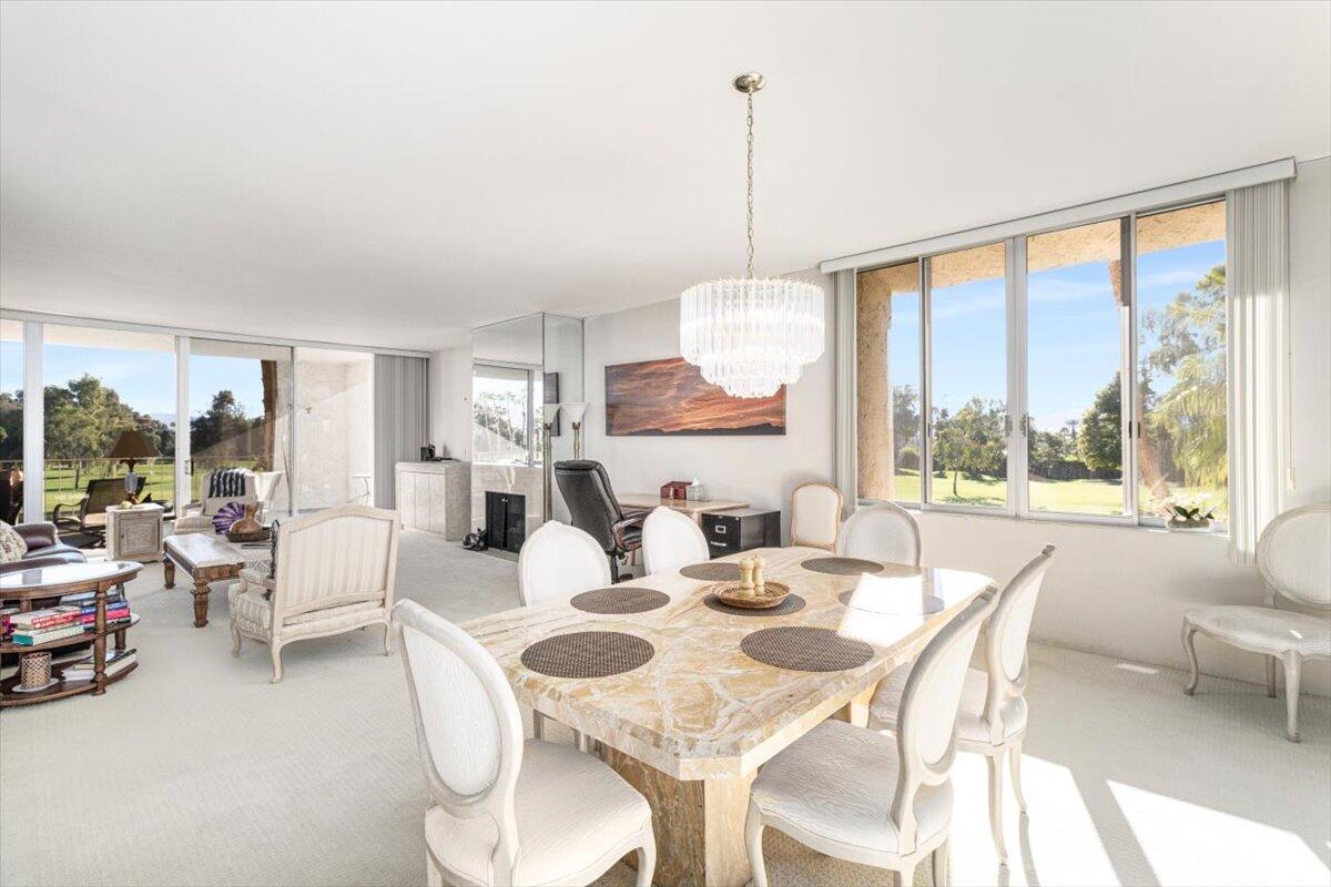 900 Island Drive, Unit 313 Rancho Mirage, CA 92270 - Photo 15 of 62 a view of a dining room with furniture window and outside view