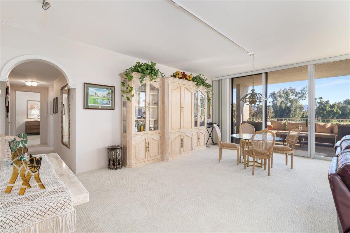 900 Island Drive, Unit 313 Rancho Mirage, CA 92270 - Photo 19 of 62 a living room with furniture and a large window