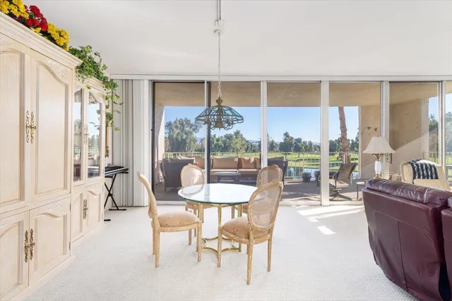 a view of a livingroom with furniture and a potted plant