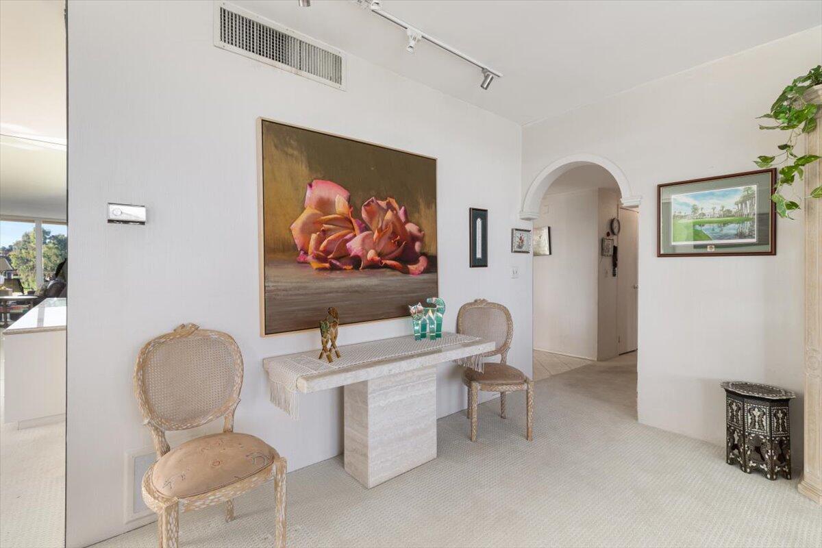 900 Island Drive, Unit 313 Rancho Mirage, CA 92270 - Photo 22 of 62 a view of a livingroom with furniture and a potted plant