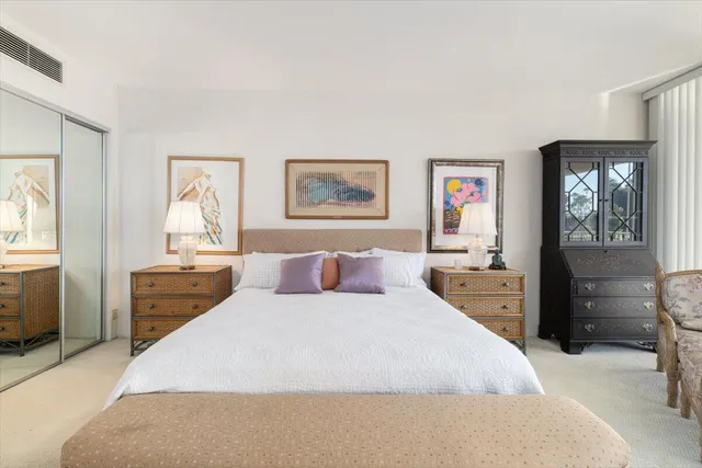 a bathroom with double vanity sinks and a mirror