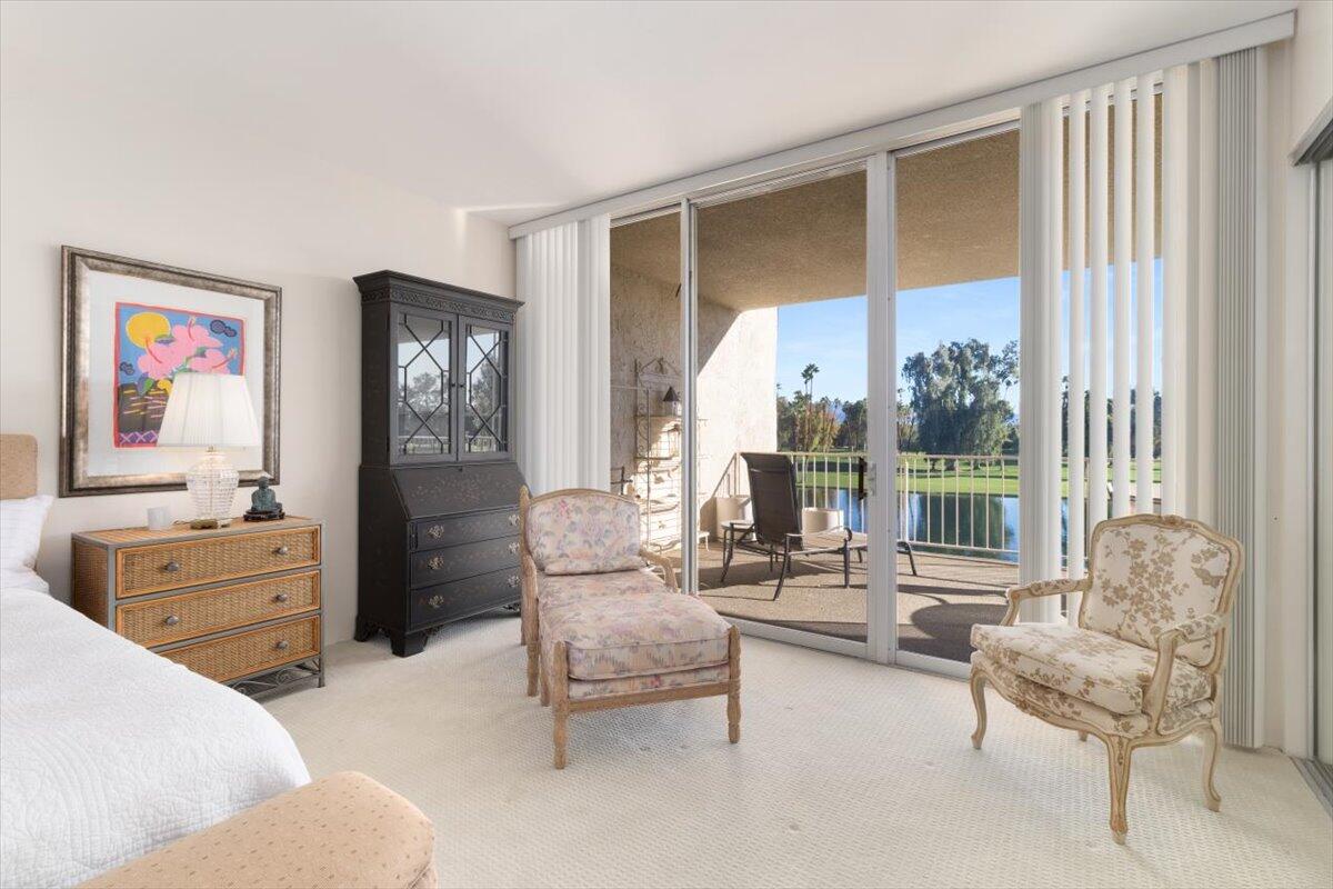 900 Island Drive, Unit 313 Rancho Mirage, CA 92270 - Photo 28 of 62 a living room with furniture and a large window