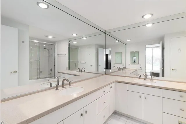 a view of a balcony with wooden floor and outdoor seating