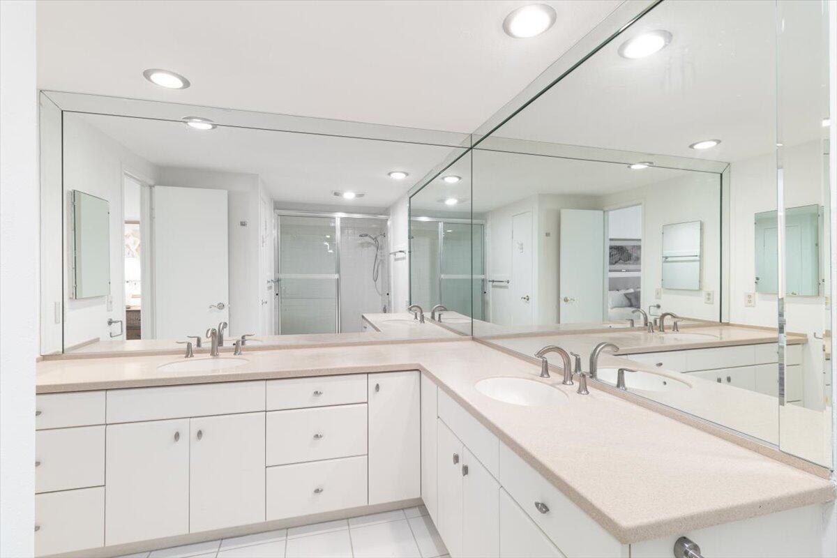 900 Island Drive, Unit 313 Rancho Mirage, CA 92270 - Photo 31 of 62 a bathroom with a sink double vanity and a mirror