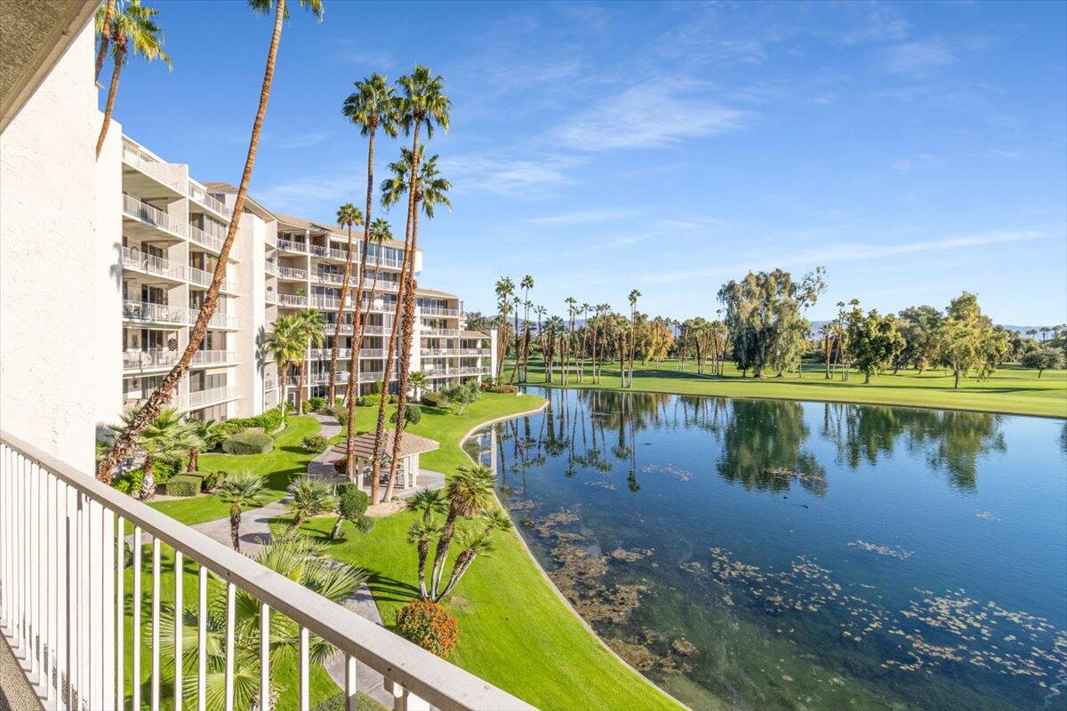 900 Island Drive, Unit 313 Rancho Mirage, CA 92270 - Photo 35 of 62 a view of a lake with a building in the background