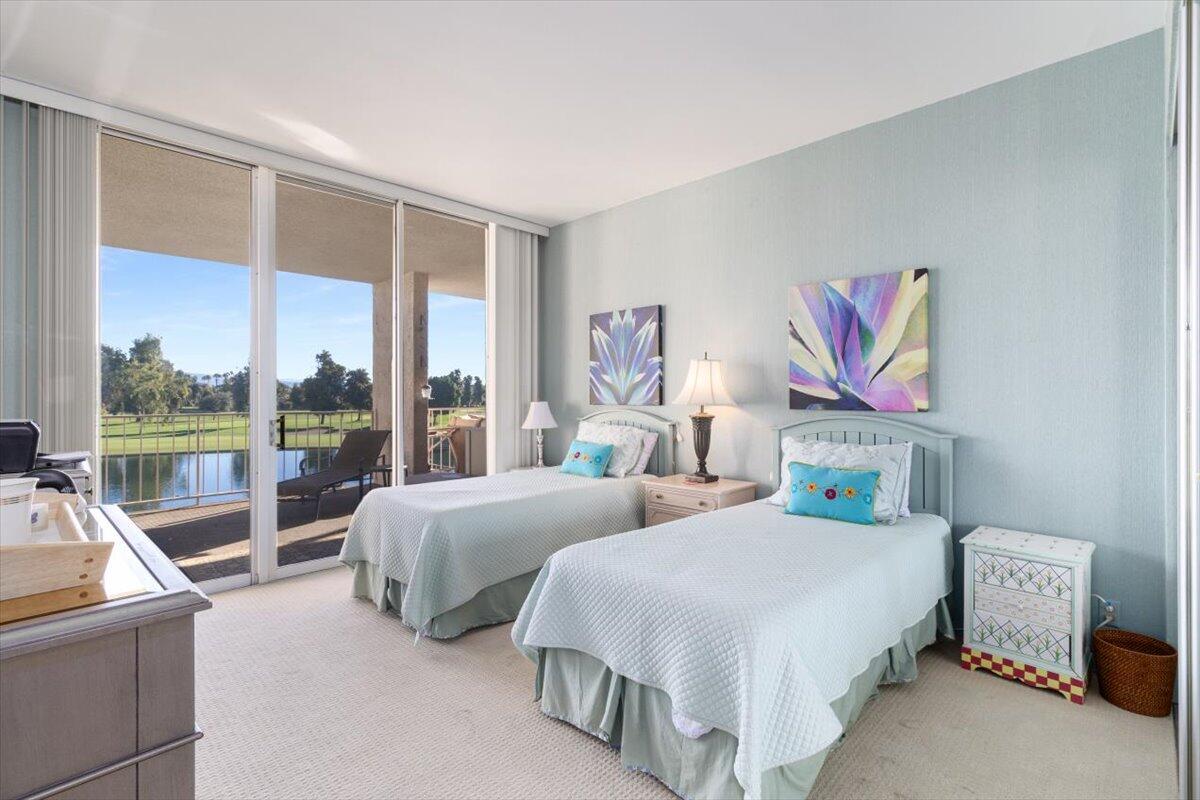 900 Island Drive, Unit 313 Rancho Mirage, CA 92270 - Photo 37 of 62 a bedroom with two beds and a large window