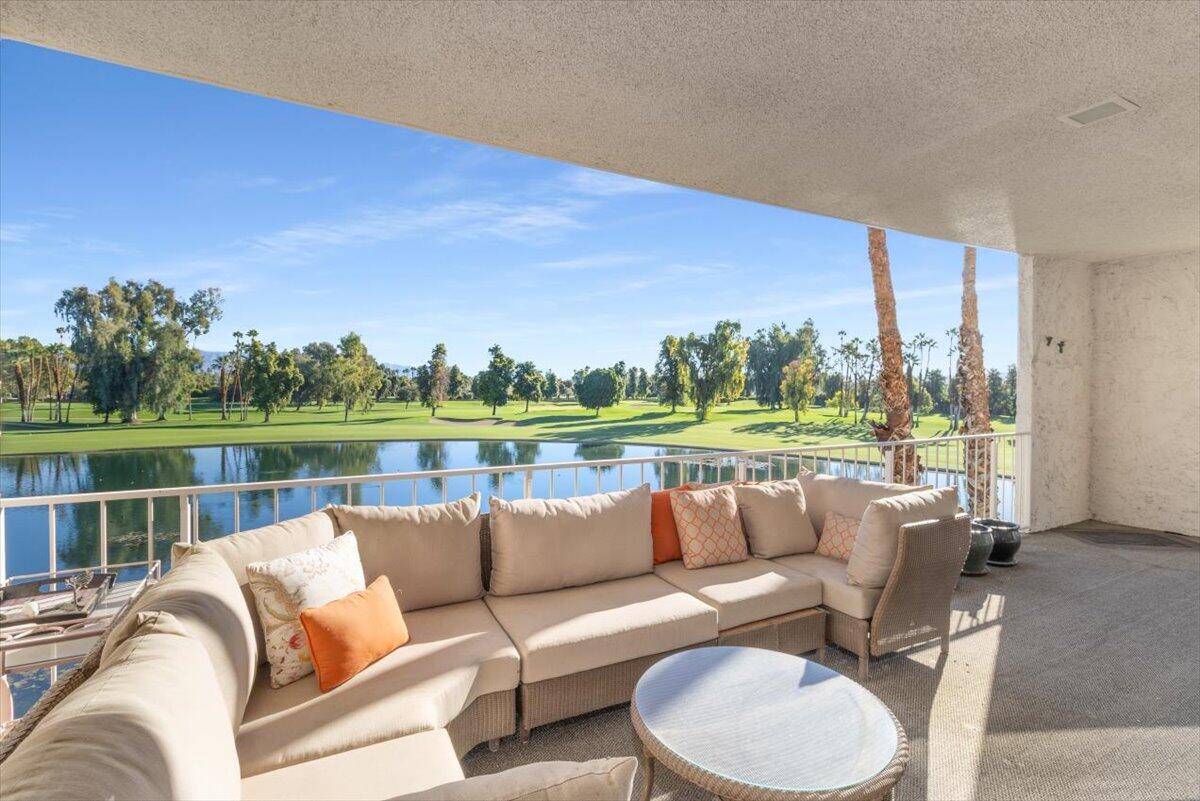 900 Island Drive, Unit 313 Rancho Mirage, CA 92270 - Photo 41 of 62 a roof deck with couches and potted plants