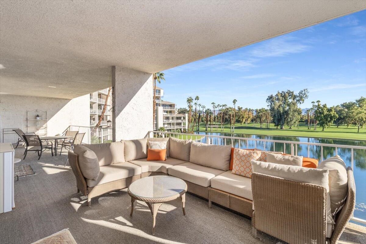 900 Island Drive, Unit 313 Rancho Mirage, CA 92270 - Photo 46 of 62 a balcony with furniture and a potted plant
