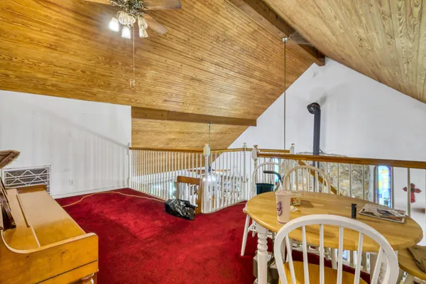 a bedroom with a bed and a bookshelf