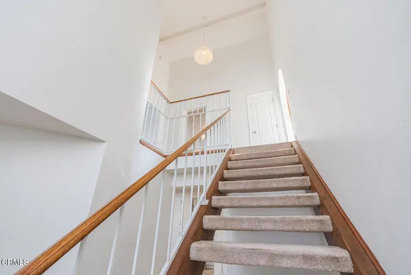 a view of a house with porch and furniture